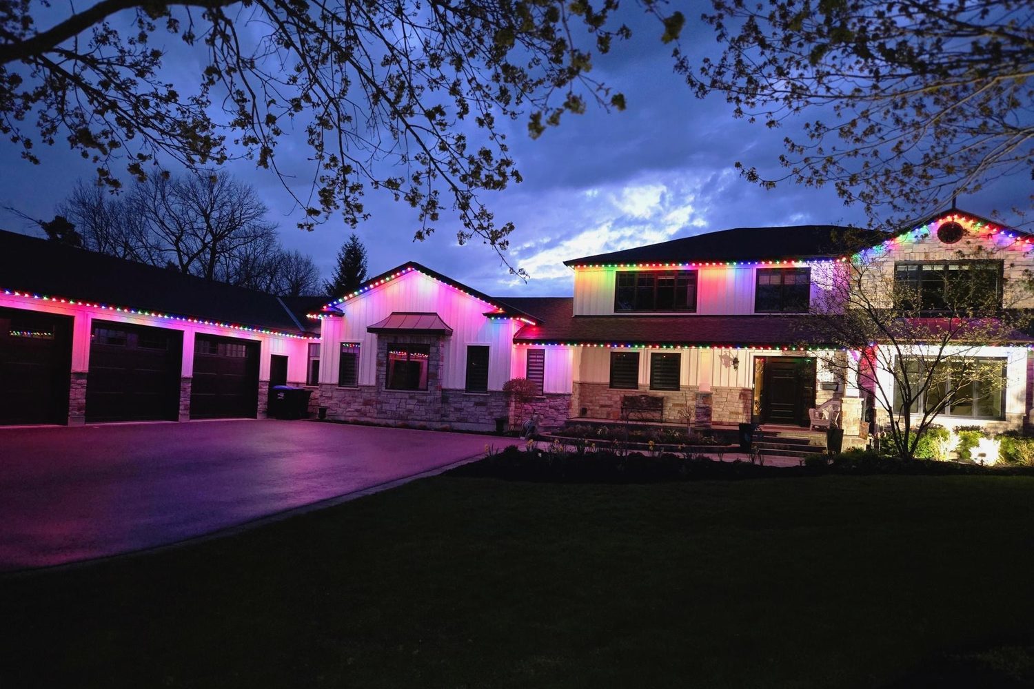 Large home with colour permanent lighting at dusk